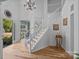 Inviting foyer featuring a staircase, hardwood floors, and natural light at 148 Spring Grove Dr, Mooresville, NC 28117