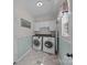 Well-lit laundry room with modern washer and dryer units at 148 Spring Grove Dr, Mooresville, NC 28117