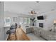 Inviting living room boasts hardwood floors, a fireplace, and modern ceiling fan at 148 Spring Grove Dr, Mooresville, NC 28117