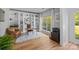 Bright office featuring custom built-ins, hardwood floors, and a large window at 148 Spring Grove Dr, Mooresville, NC 28117