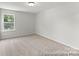 Well-lit bedroom featuring neutral carpet, bright walls, and a window for natural light and fresh air at 1503 Autumn Banks Way # 3P, High Shoals, NC 28077