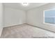 Cozy bedroom featuring plush neutral carpet, a ceiling light, and a window with natural light at 1503 Autumn Banks Way # 3P, High Shoals, NC 28077