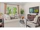 Bright living room with large windows, comfortable seating, and modern decor at 1509 Autumn Banks Way # 4P, High Shoals, NC 28077