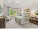 Serene bedroom with a tray ceiling, large window, and neutral decor at 1509 Autumn Banks Way # 4P, High Shoals, NC 28077