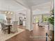 Open-concept layout with dining room, kitchen, and living room featuring hardwood floors at 1509 Autumn Banks Way # 4P, High Shoals, NC 28077