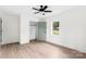 Bedroom featuring a window, ceiling fan, closet with an open door, and hardwood floors at 1537 Spangler Dr, Shelby, NC 28150