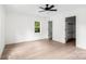Bright, spacious bedroom featuring a ceiling fan, hardwood floors, one window, and a large walk-in closet at 1537 Spangler Dr, Shelby, NC 28150
