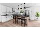 Modern kitchen with white cabinets, stainless steel appliances, granite countertops, and a stylish island with bar stools at 1537 Spangler Dr, Shelby, NC 28150