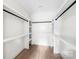 A walk-in closet features built-in shelving and hanging rods, providing ample storage space and organization at 1537 Spangler Dr, Shelby, NC 28150