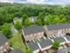 Aerial view of townhomes surrounded by lush greenery at 16930 Summers Walk Blvd, Davidson, NC 28036
