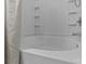 Clean white tub and shower combo with built in shelving and decorative shower curtain at 16930 Summers Walk Blvd, Davidson, NC 28036