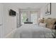 Cozy bedroom with wall-mounted TV and an Eiffel Tower art print at 16930 Summers Walk Blvd, Davidson, NC 28036