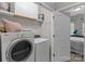 Laundry room with washer, dryer, and white storage cabinets at 16930 Summers Walk Blvd, Davidson, NC 28036