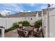 Charming patio with outdoor seating surrounded by lush greenery and a privacy fence at 16930 Summers Walk Blvd, Davidson, NC 28036