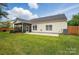 Charming home with a well-maintained backyard, screened porch, and adjacent patio at 170 Heywatchis Dr, Mooresville, NC 28115
