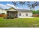 View of a well-kept backyard featuring a patio and screened porch from the rear of the home at 170 Heywatchis Dr, Mooresville, NC 28115