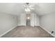 This bedroom features neutral walls and carpet, ceiling fan, and closet at 170 Heywatchis Dr, Mooresville, NC 28115