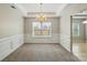 Formal dining room with carpet flooring, decorative molding, and a chandelier at 170 Heywatchis Dr, Mooresville, NC 28115