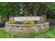 Beautiful Linwood Farms community entrance with colorful flowers and stone masonry at 170 Heywatchis Dr, Mooresville, NC 28115