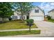 Charming two-story home with a well-maintained lawn, white garage door, and blue shutters at 170 Heywatchis Dr, Mooresville, NC 28115