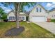 Charming two-story home with a well-maintained lawn, mature trees and blue shutters at 170 Heywatchis Dr, Mooresville, NC 28115