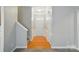 Bright foyer with hardwood floors, stairs, and white trim at 170 Heywatchis Dr, Mooresville, NC 28115