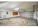 This is a two car garage with some stains on the floor and tools at 170 Heywatchis Dr, Mooresville, NC 28115
