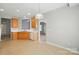 A kitchen featuring wood cabinets, white appliances, and tile flooring at 170 Heywatchis Dr, Mooresville, NC 28115