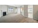 Expansive living room featuring a fireplace, ceiling fan and carpet at 170 Heywatchis Dr, Mooresville, NC 28115