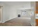 Spacious living room featuring a fireplace, ceiling fan and carpet at 170 Heywatchis Dr, Mooresville, NC 28115