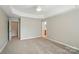 Primary bedroom with carpet flooring, ceiling fan, and natural light at 170 Heywatchis Dr, Mooresville, NC 28115