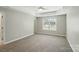 Primary bedroom with carpet flooring, ceiling fan, and natural light at 170 Heywatchis Dr, Mooresville, NC 28115