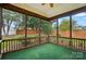 Enjoy this screened porch overlooking a spacious backyard with a well-maintained fence at 170 Heywatchis Dr, Mooresville, NC 28115