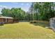 Expansive backyard features a wooden deck, swimming pool and mature landscaping at 1753 Elmwood Dr, Rock Hill, SC 29730