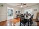 Dining room with wood floors, view to kitchen, view to Gathering room and a large dining table with seating at 1753 Elmwood Dr, Rock Hill, SC 29730