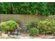Landscaped yard with mature bushes and outdoor seating area at 1753 Elmwood Dr, Rock Hill, SC 29730