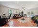 Gathering room with tile floors, ceiling fan, leather sofa, and view to the pool through the back doors at 1753 Elmwood Dr, Rock Hill, SC 29730