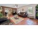 Comfortable living area with warm brick accents, tile floor and cozy decor at 1753 Elmwood Dr, Rock Hill, SC 29730