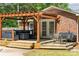 Outdoor deck with pergola features seating and grilling space for relaxing and entertaining at 1753 Elmwood Dr, Rock Hill, SC 29730
