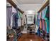 Spacious walk-in closet with wood floor, shelving, hanging rods, shoe racks, and a large mirror for dressing at 1753 Elmwood Dr, Rock Hill, SC 29730
