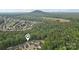 An aerial view of a home nestled among lush greenery and tree coverage at 1835 Allegheny Dr, Gastonia, NC 28054