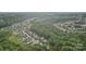 An aerial view showcasing the neighborhood, surrounded by lush greenery and tree canopy at 1835 Allegheny Dr, Gastonia, NC 28054