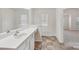 Bathroom vanity with granite counters and large mirror at 1835 Allegheny Dr, Gastonia, NC 28054