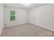 Bedroom featuring a window, carpeted floor, and a double door closet at 1835 Allegheny Dr, Gastonia, NC 28054