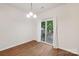 Bright dining area features wood floors, white walls, and sliding doors to an outdoor deck at 1835 Allegheny Dr, Gastonia, NC 28054