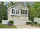 Charming two-story home with a white garage door, black shutters, and a well-manicured lawn at 1835 Allegheny Dr, Gastonia, NC 28054