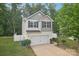 Charming two-story home with a white garage door, black shutters, and a well-manicured lawn at 1835 Allegheny Dr, Gastonia, NC 28054