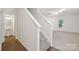 Open hallway showcasing stairs leading to a spacious room with carpet flooring and neutral paint at 1835 Allegheny Dr, Gastonia, NC 28054