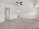 Spacious main bedroom featuring a ceiling fan and neutral carpeting at 1835 Allegheny Dr, Gastonia, NC 28054