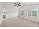 Bright main bedroom features an ensuite bathroom, vaulted ceiling, and two large windows at 1835 Allegheny Dr, Gastonia, NC 28054